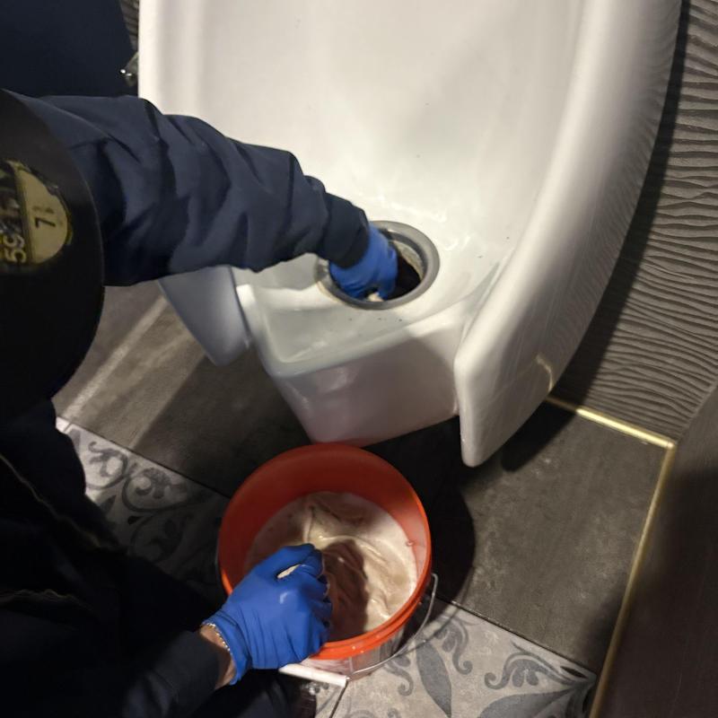 Urinal unclogging and cartridge replacement in restroom