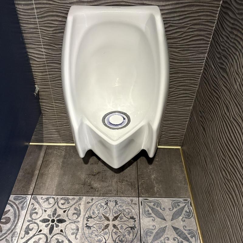 Waterless urinal cartridge replacement in commercial restroom