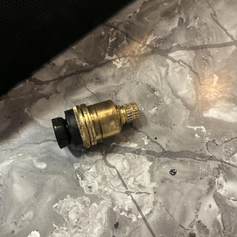 Shower faucet stem replacement part on countertop