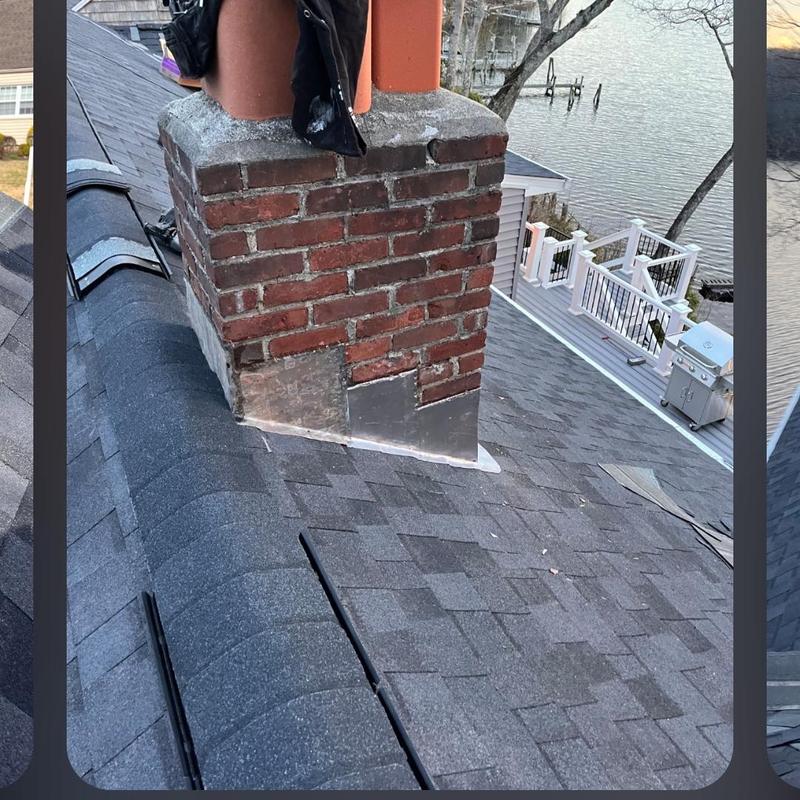 Chimney flashing on asphalt roof with shingle repair