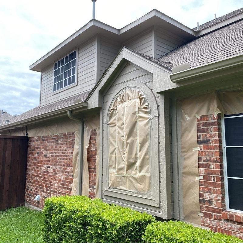 Soffit vents and trim with protective masking for painting
