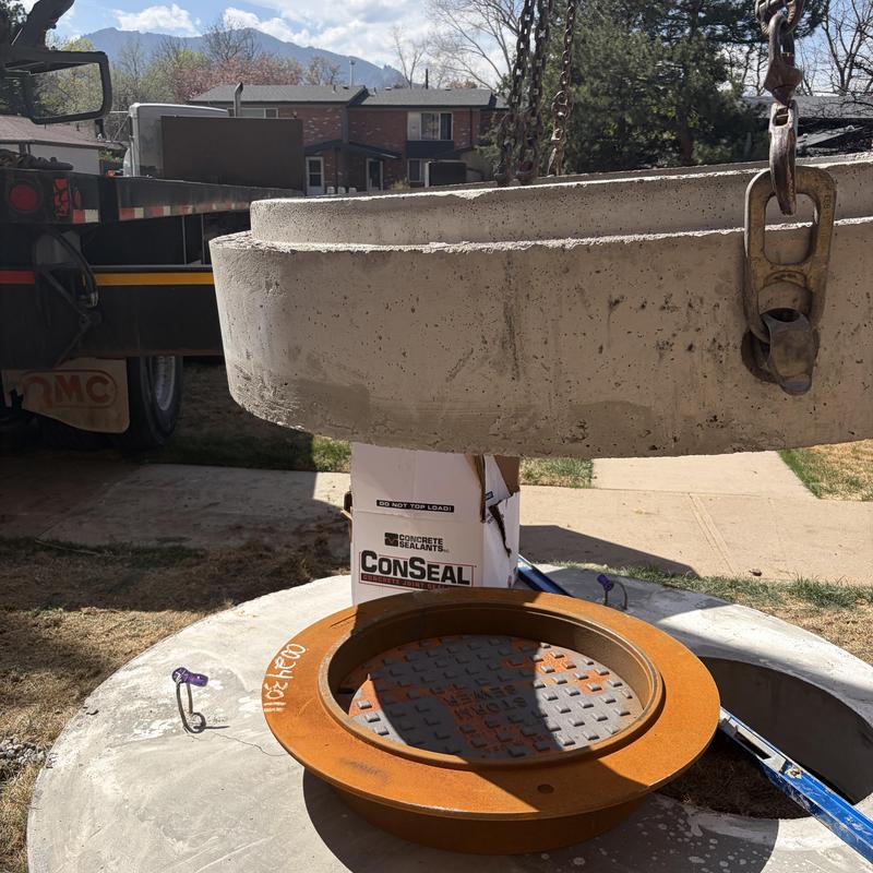 Utility vault installation with concrete lid and ring