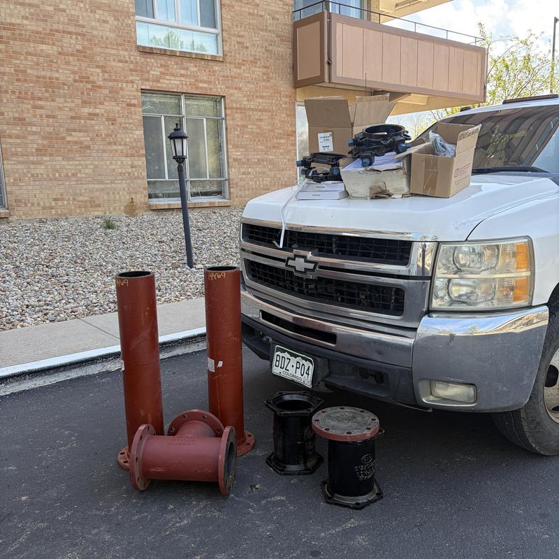 6-inch back-flow preventer and utility vault parts by truck
