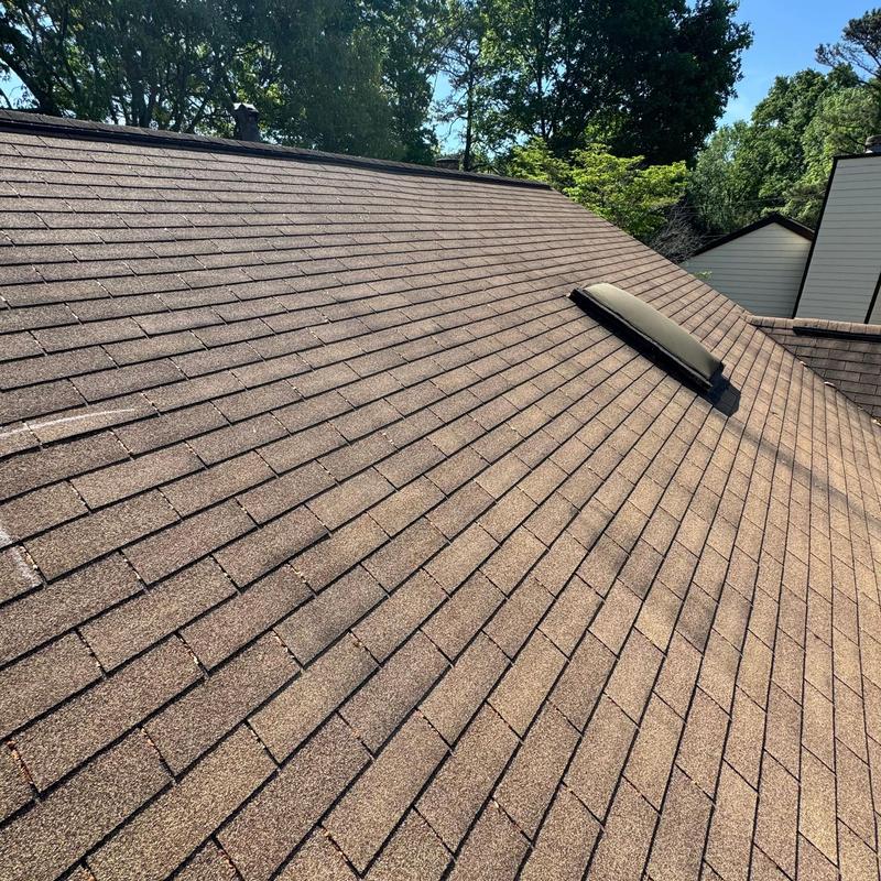 Asphalt shingle roof with vent during hail damage inspection