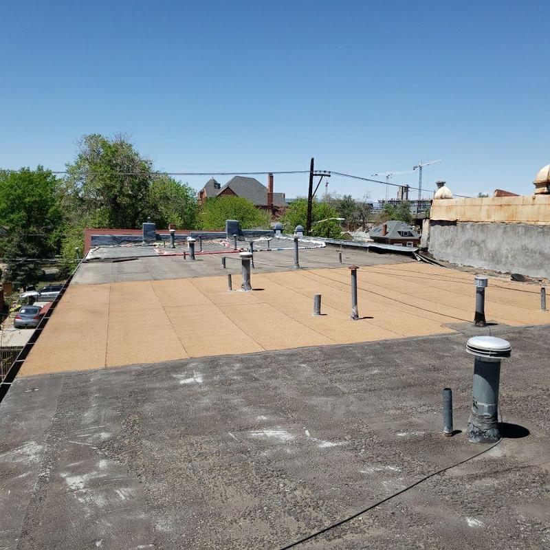 Modified bitumen flat roof with multiple vent pipes Modified bitumen flat roof with multiple vent pipes