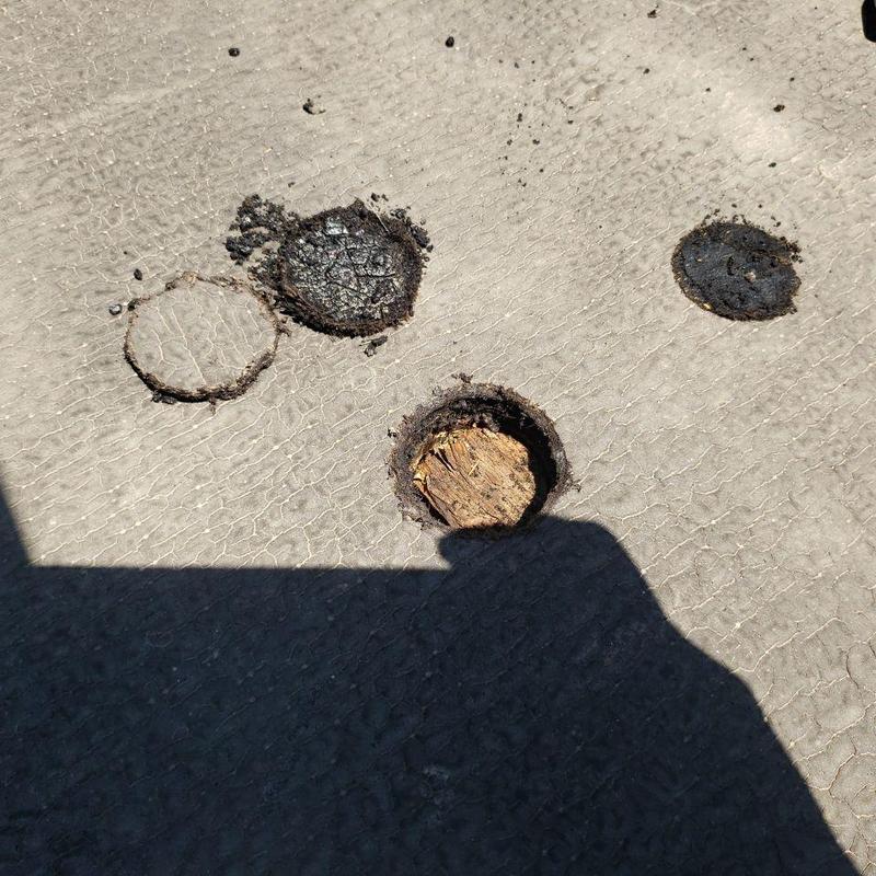 Modified bitumen roof patches with exposed wood decking Modified bitumen roof patches with exposed wood decking