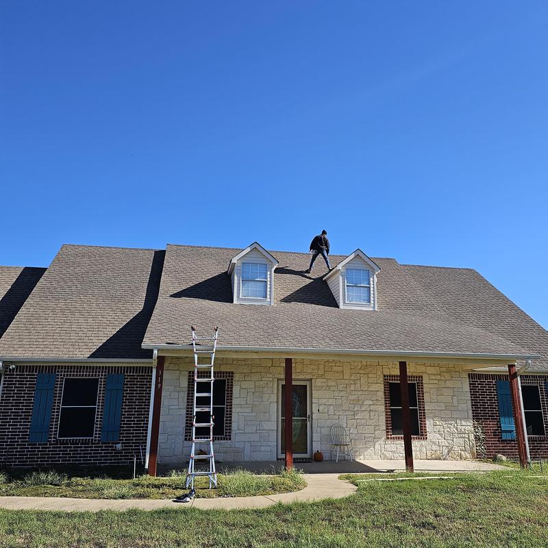 Asphalt shingle roof with hail damage inspection