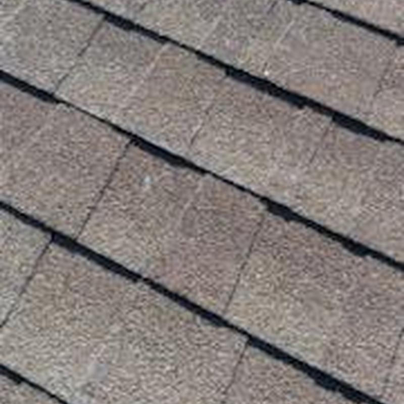 Roof shingles with hail damage close-up view