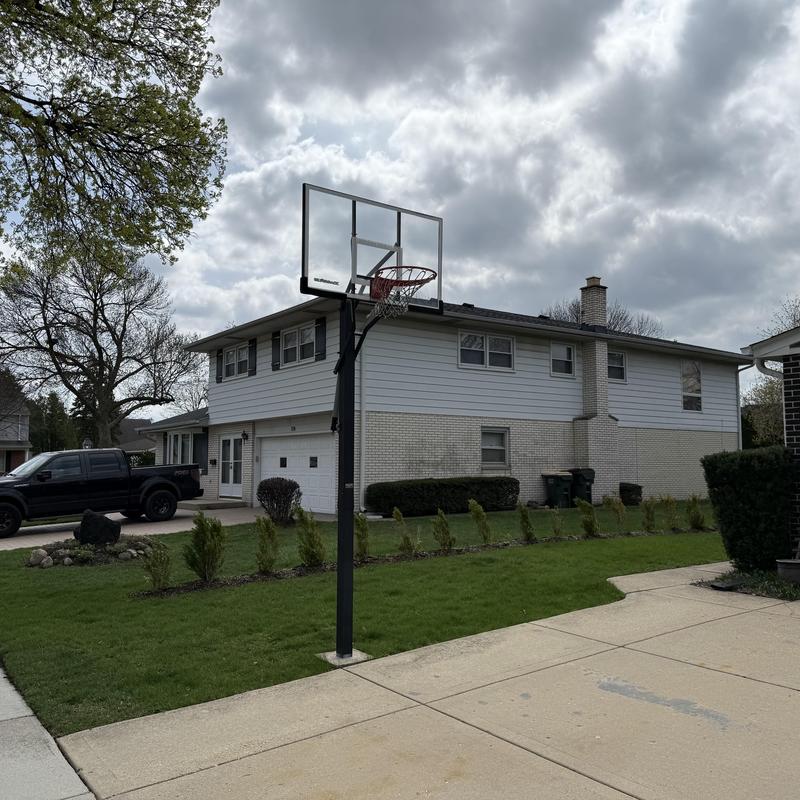 Asphalt shingle roof on two-story suburban house