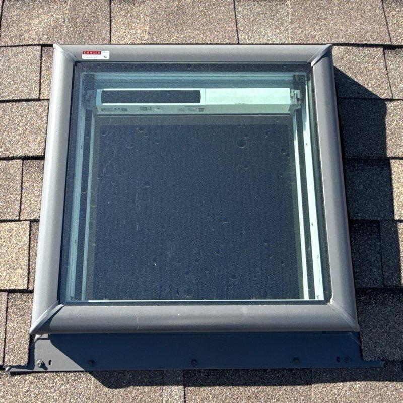 Velux QPF skylight with solar powered shade on roof