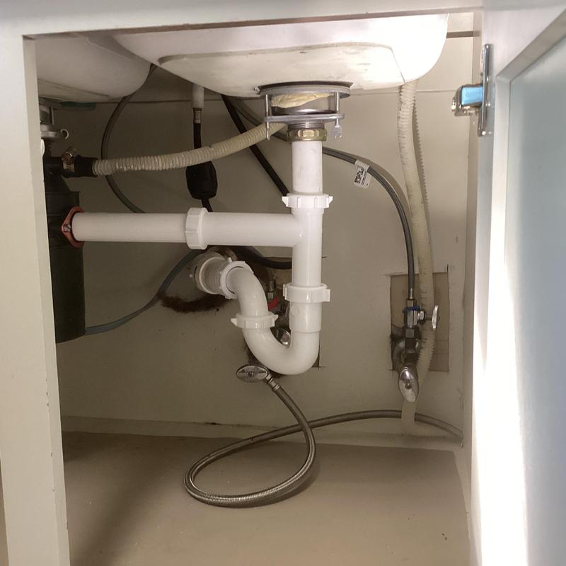 Kitchen sink drain and disposal plumbing assembly