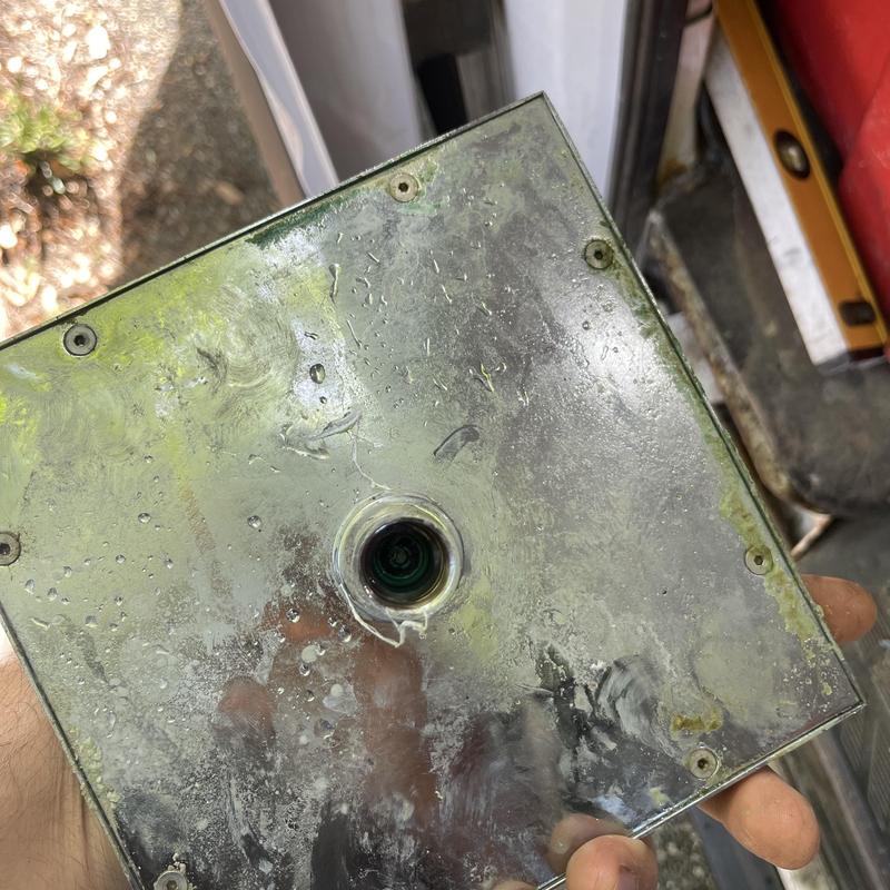 Showerhead base plate with mineral buildup and corrosion Showerhead base plate with mineral buildup and corrosion