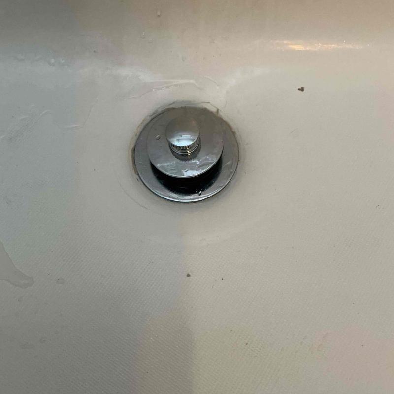 Tub stopper installed in bathtub drain opening