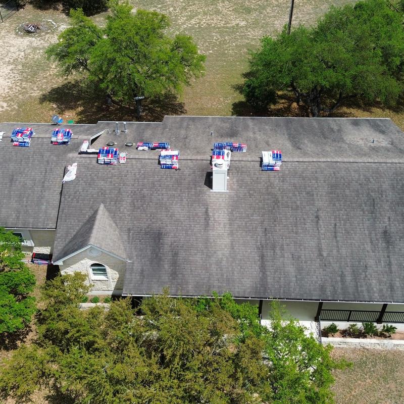 Asphalt shingle roof with bundled materials for replacement
