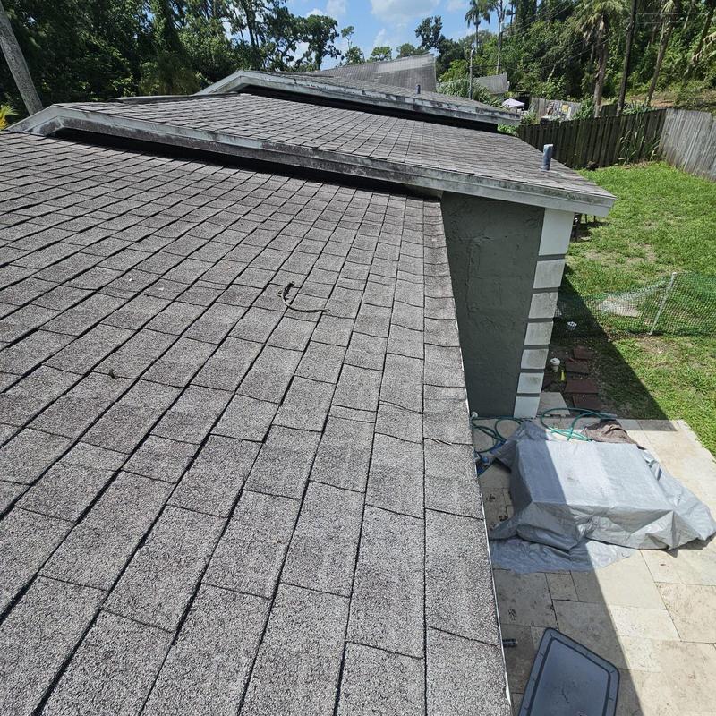 Shingle roof with worn and damaged areas in Naples, FL