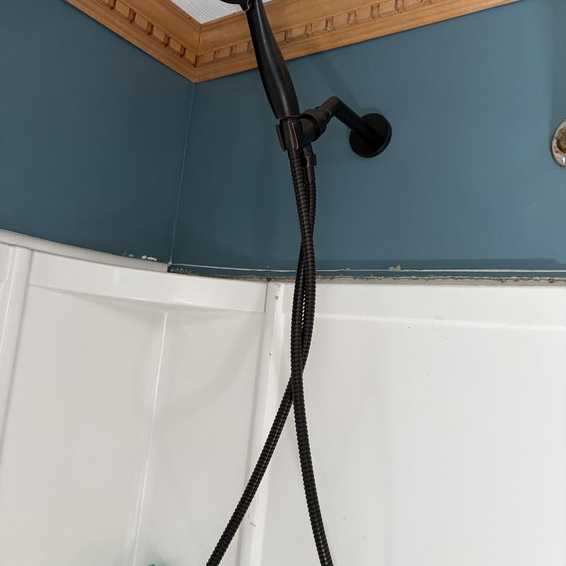 Shower valve installation with black handheld showerhead
