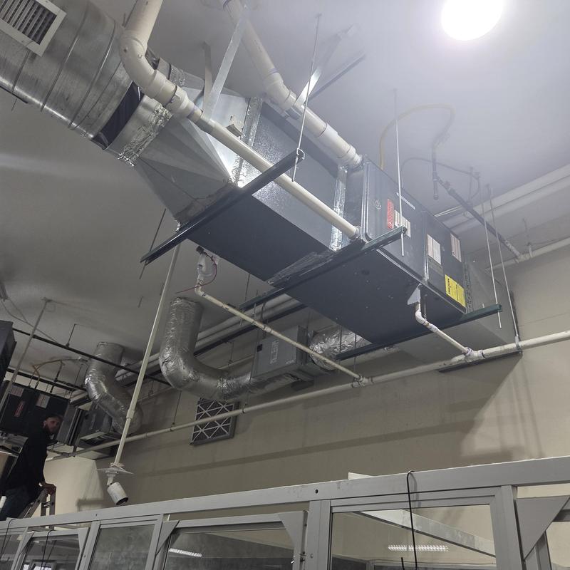 Air handler unit with ductwork in commercial space