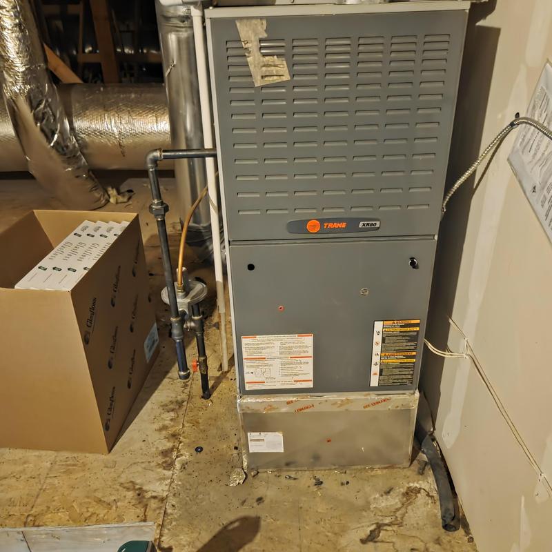 Trane XR80 gas furnace in utility room