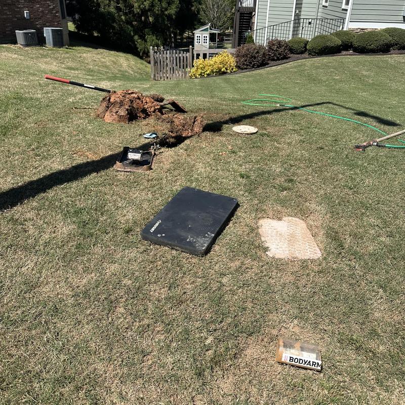 Main water line excavation and leak repair in yard