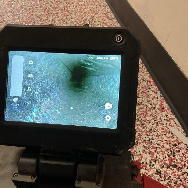 Toilet drain inspection camera showing clear pipe interior