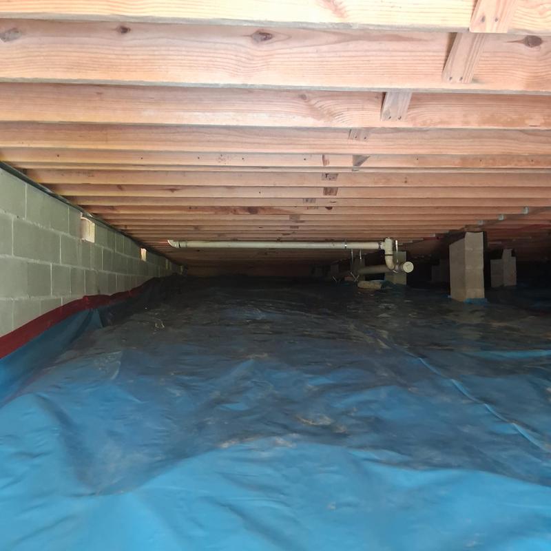 Moisture barrier installed under wooden subfloor joists