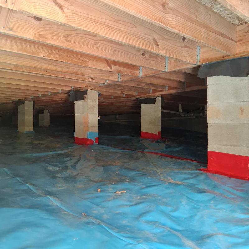 Moisture barrier under crawl space subfloor framing