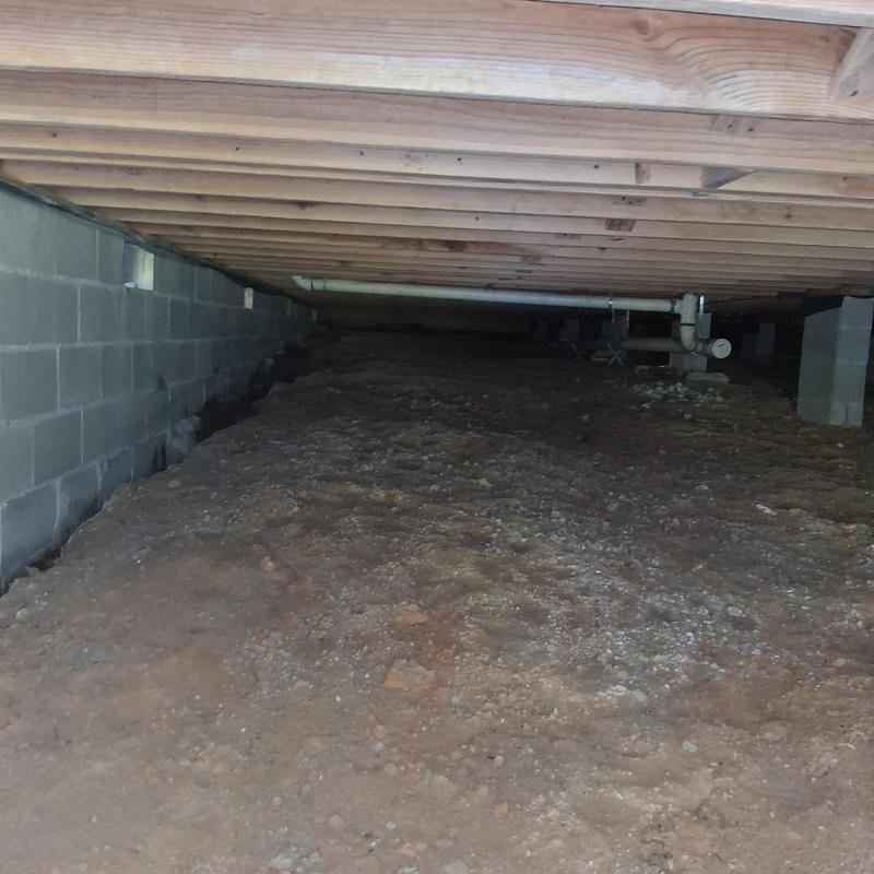 Crawlspace moisture barrier installation under subfloor