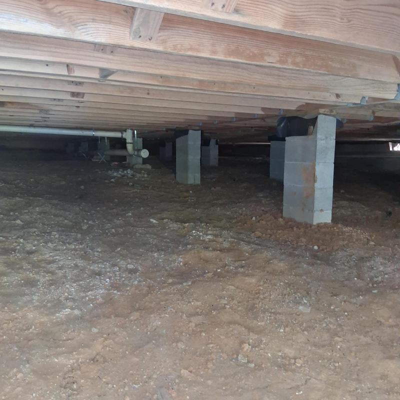 Crawl space dirt floor under subfloor without moisture barrier
