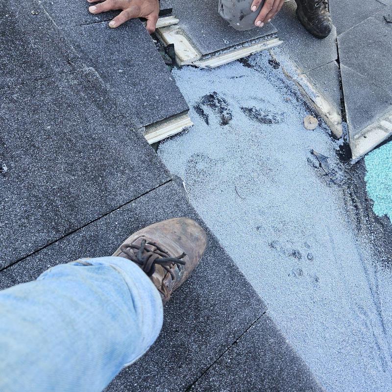Concrete tile roof with repair work in progress