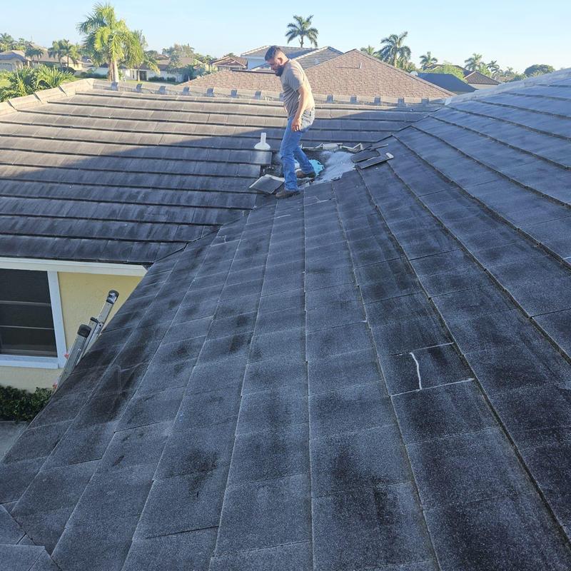 Concrete tile roof with patch repairs and water testing