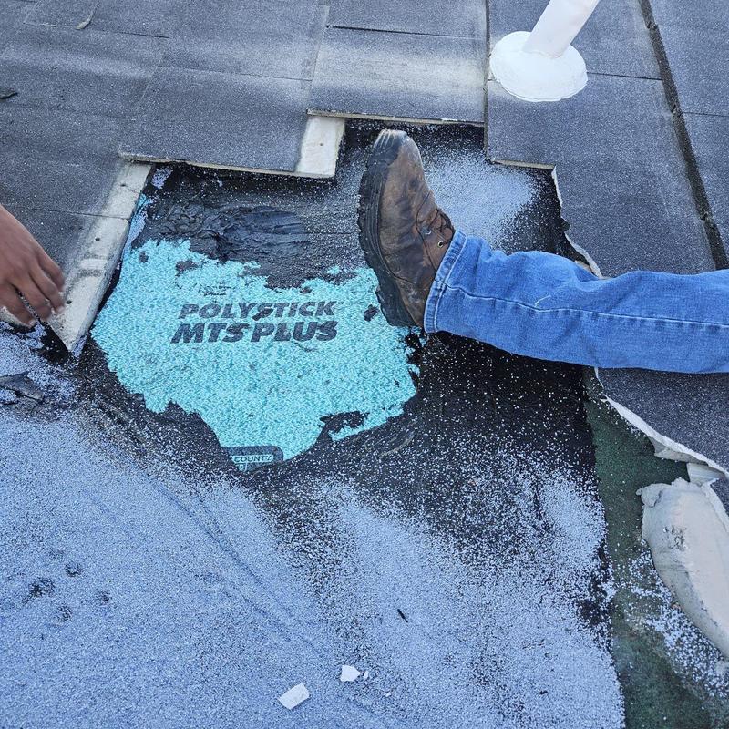 Roof underlayment removal for repair with flashing pipe nearby