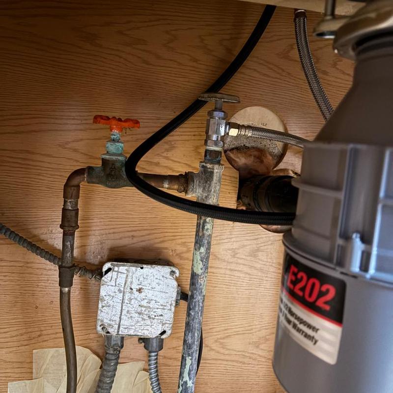 Dishwasher drain line and shutoff valve under sink
