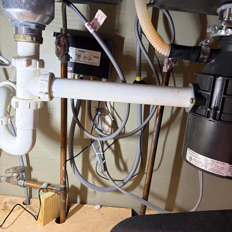 Garbage disposal and drain pipe installation under sink