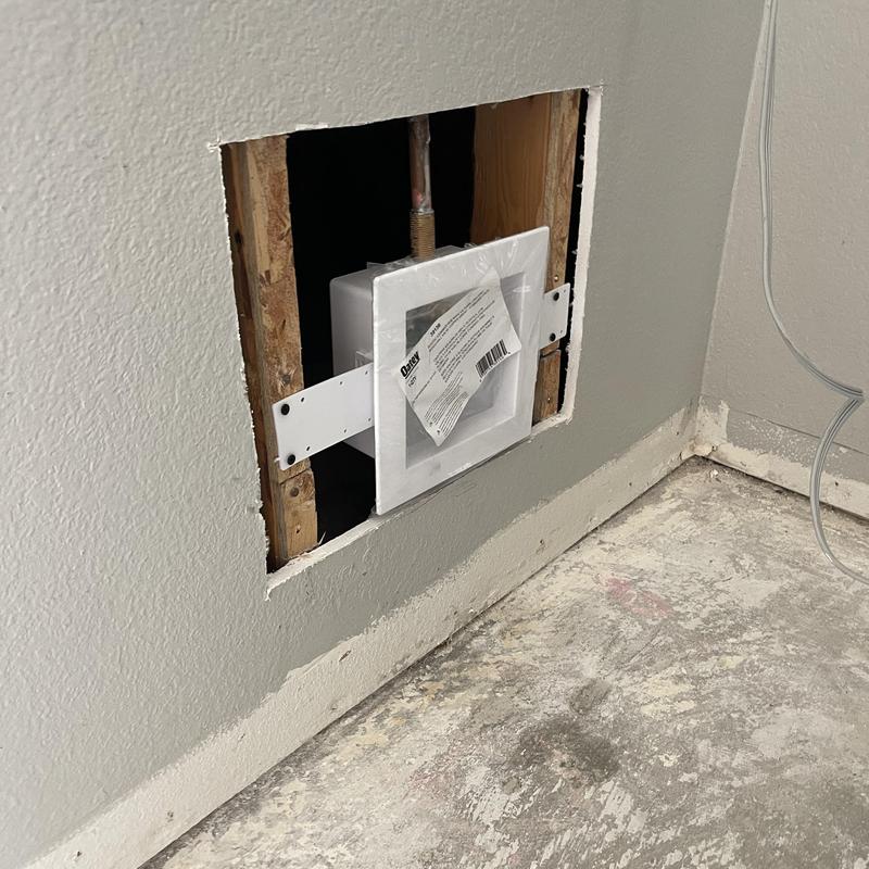 Washer hookup box installation in wall cavity