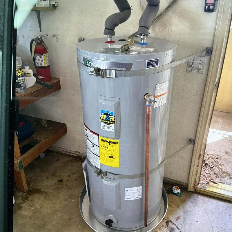 Electric water heater with copper supply line installed