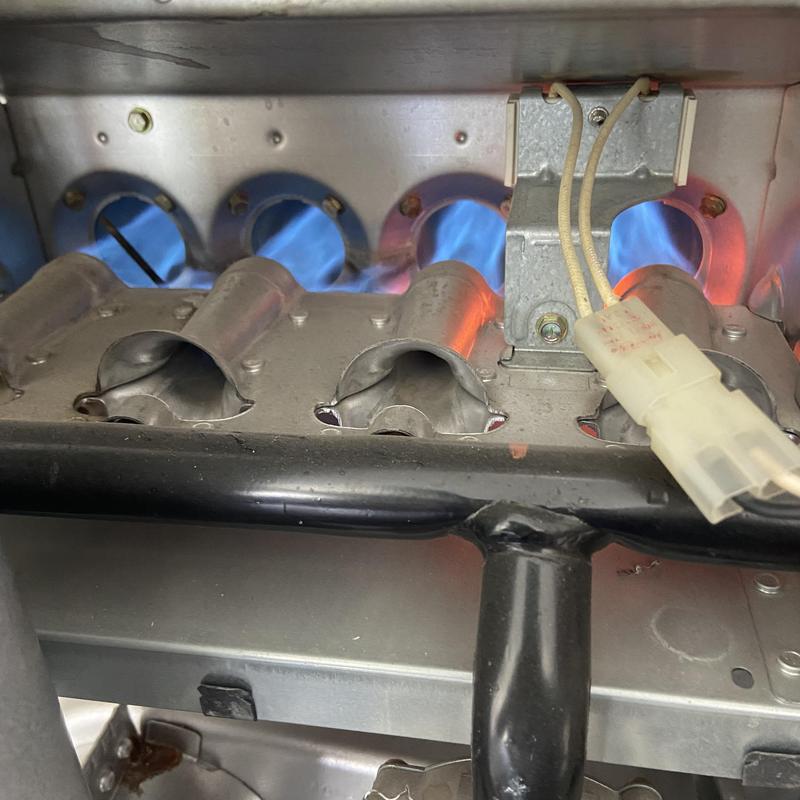 Gas furnace burner flames with igniter wires