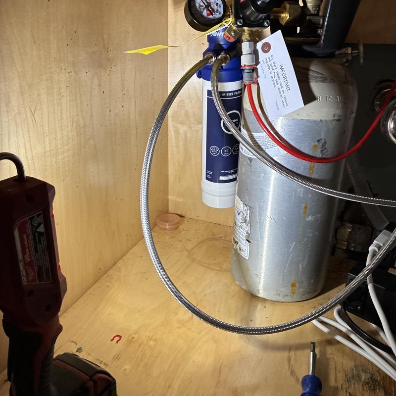 Under-sink water filtration system with pressure gauge installation