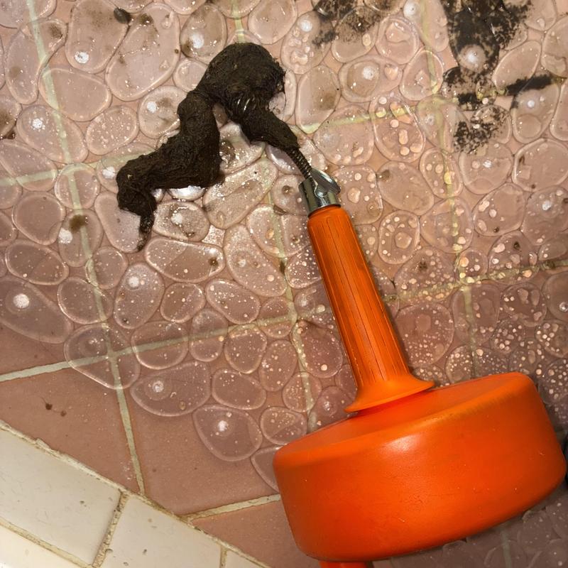 Shower drain clog removed with plumbing auger cable