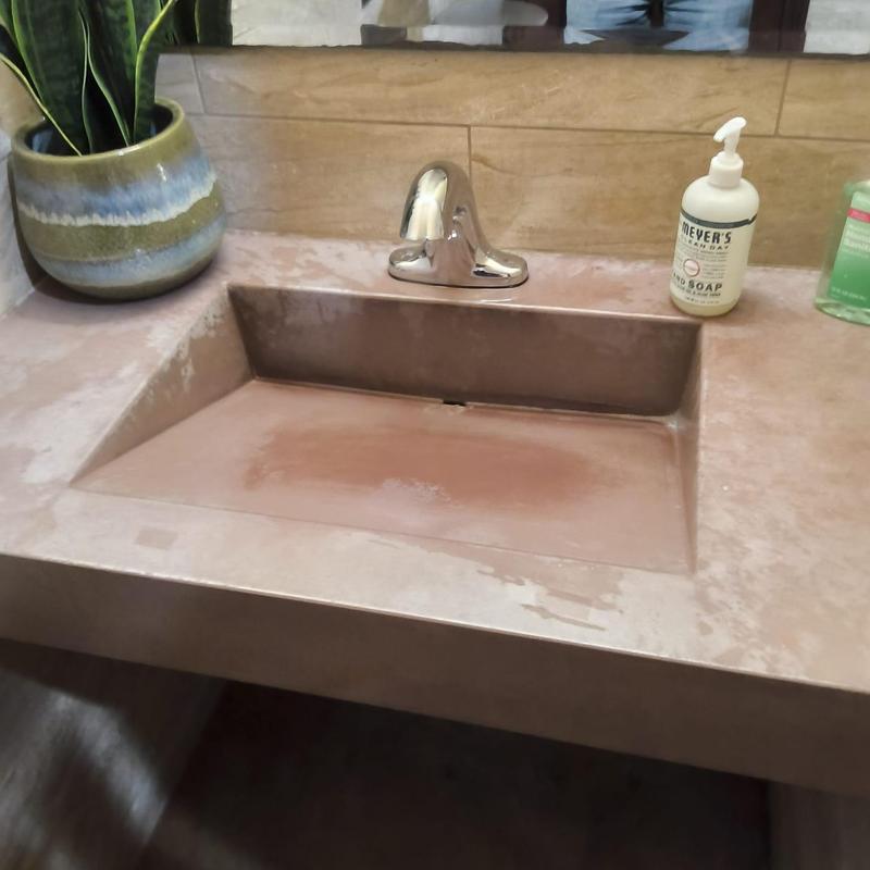 Bathroom sink faucet with soap dispensers nearby