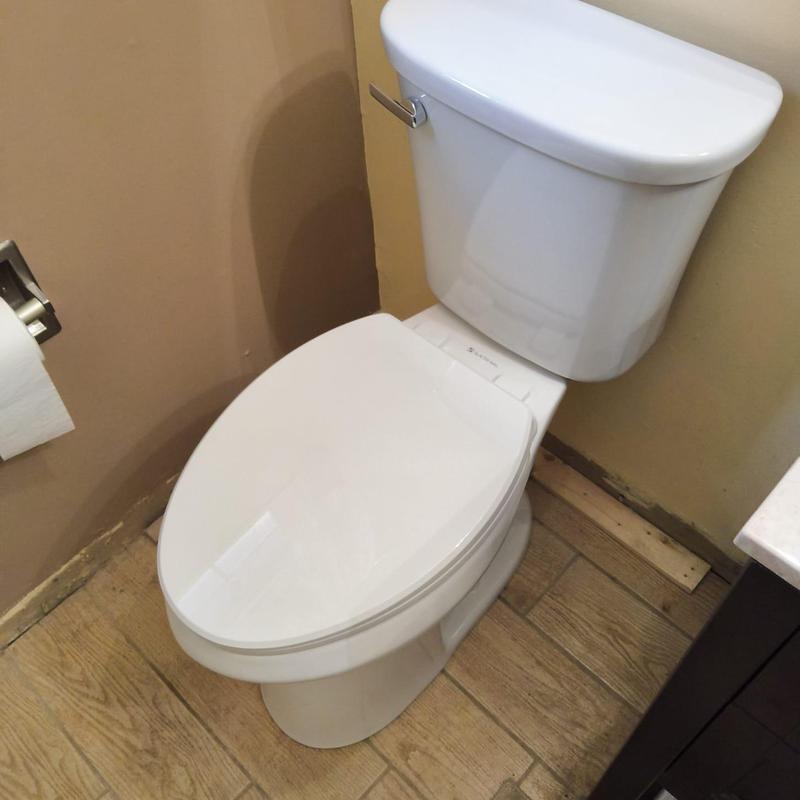 Toilet installation in small bathroom corner