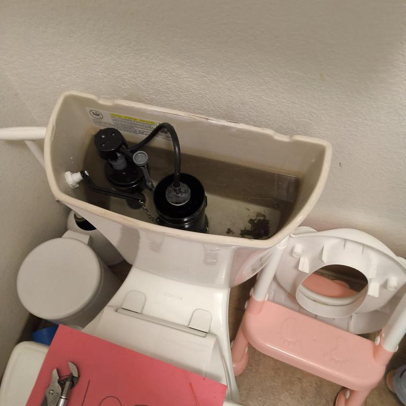 Toilet flush valve and fill valve inside tank