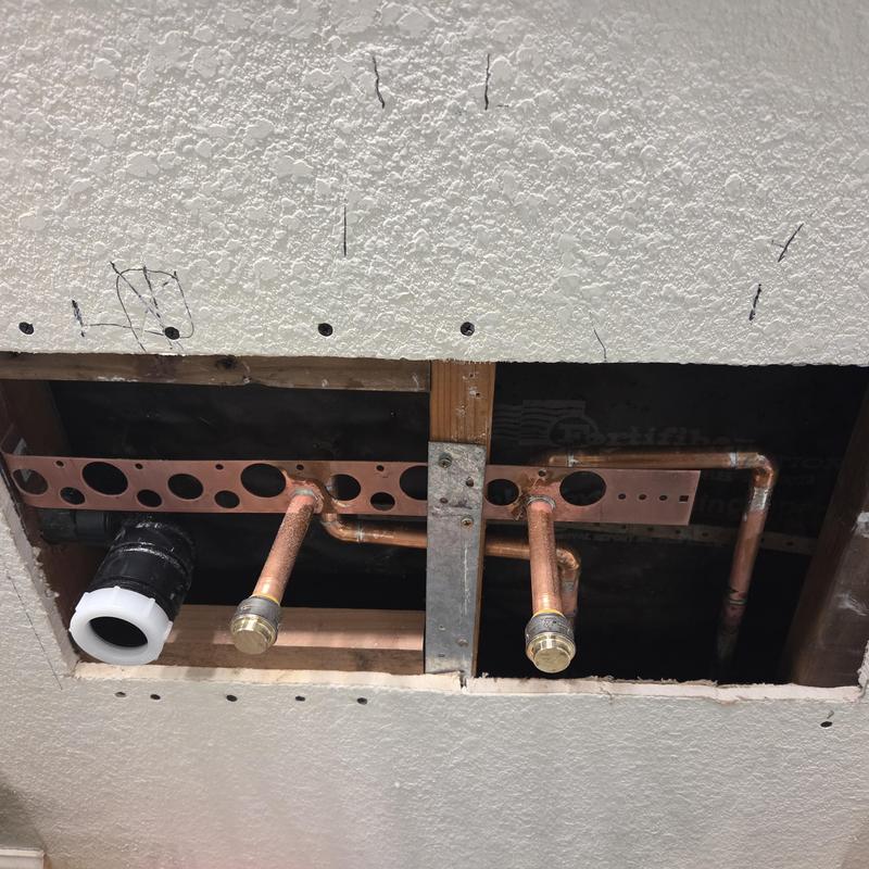 Offset sink plumbing rough-in with copper pipes