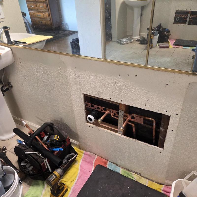 Custom vanity plumbing rough-in with copper pipes