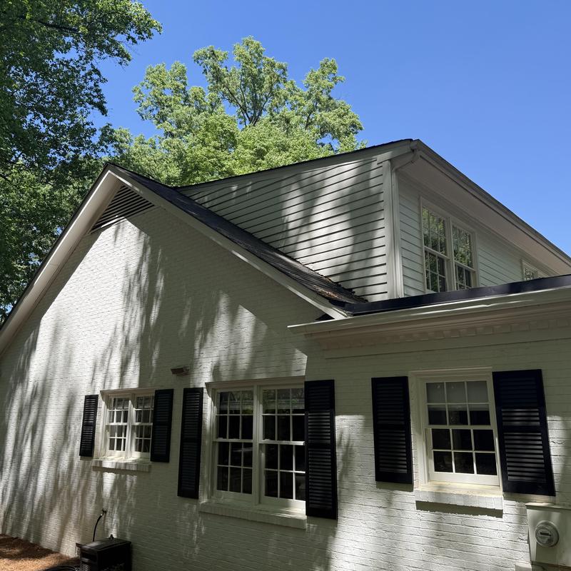 Kickout diverter flashing at roof-to-wall interface