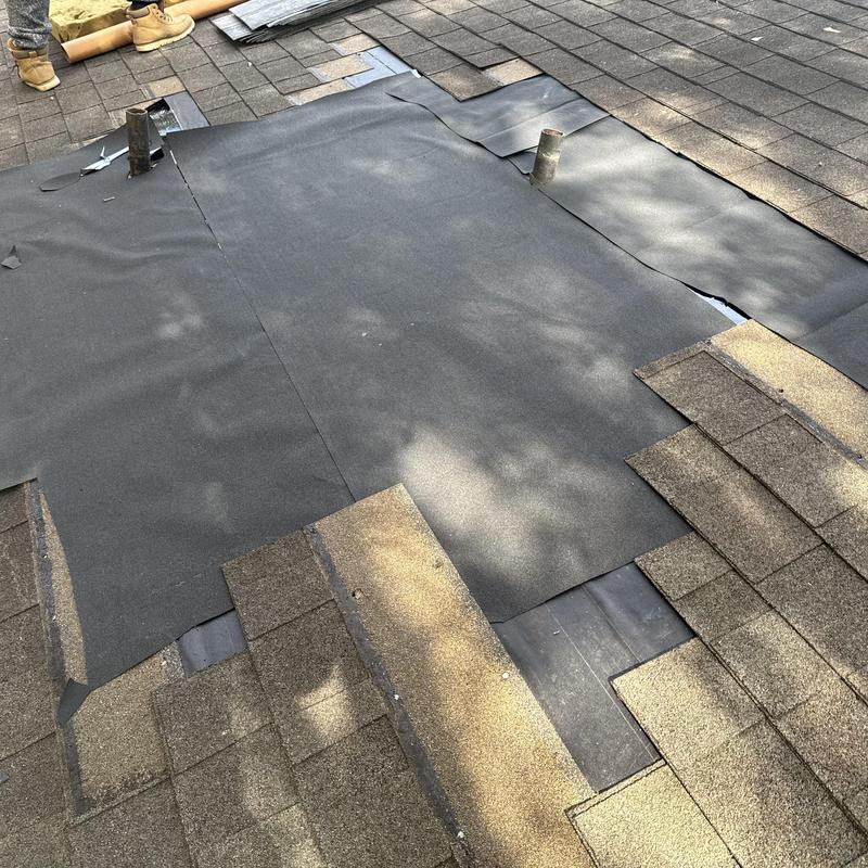 Roof pipe boot with new roofing underlayment installation