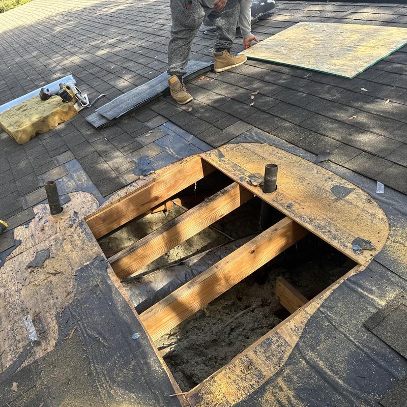 Roof plywood removal exposing joists during repair