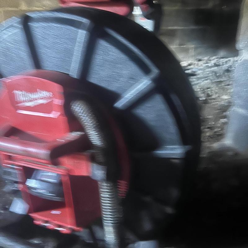 Drain cleaning jet machine with hose reel setup