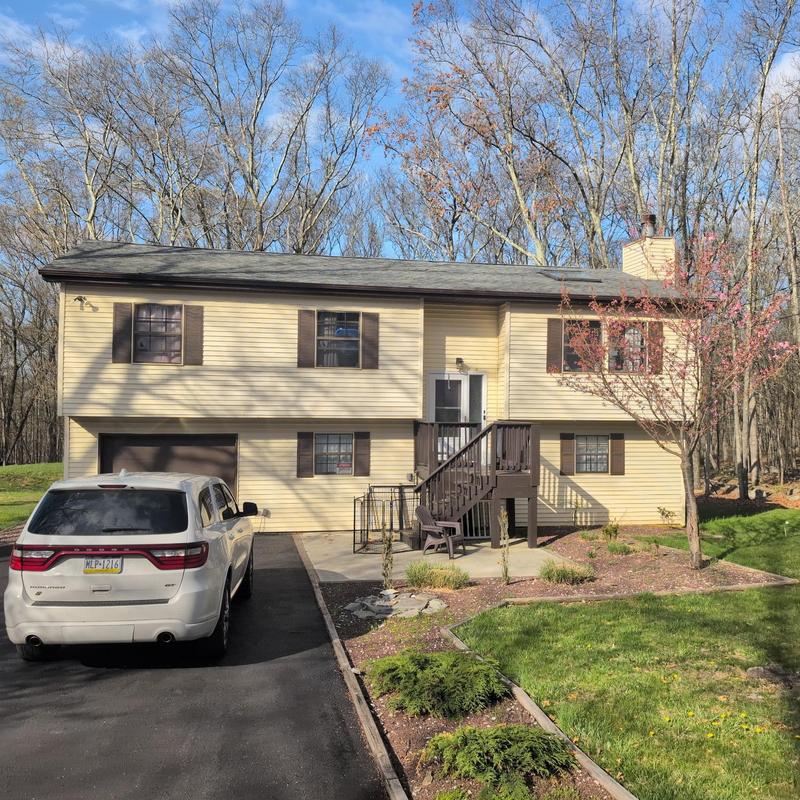 Asphalt shingle roof inspection on suburban house Asphalt shingle roof inspection on suburban house