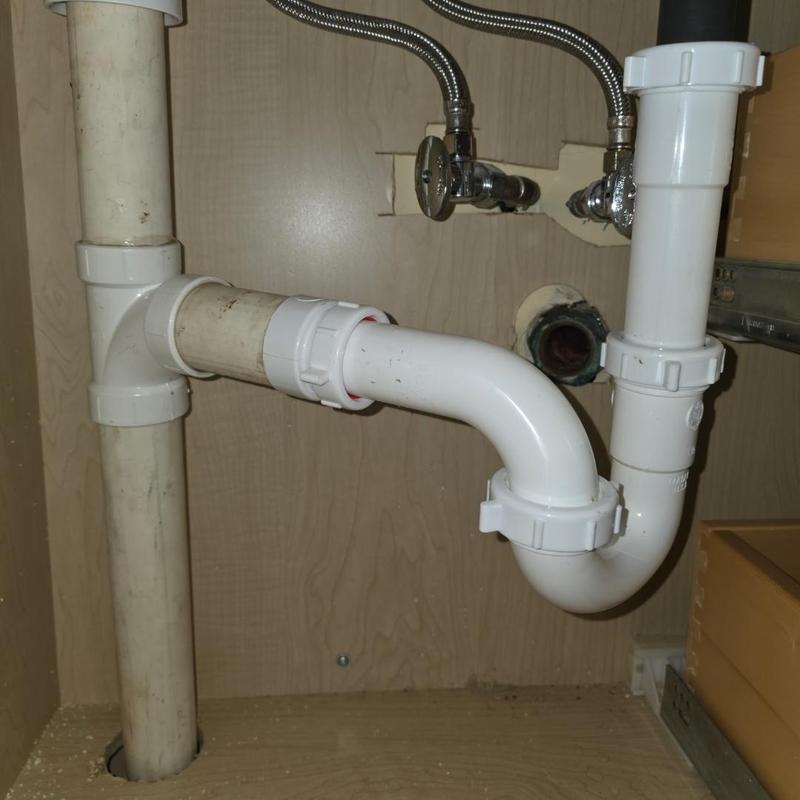 PVC drain pipe installation under sink with shutoff valves