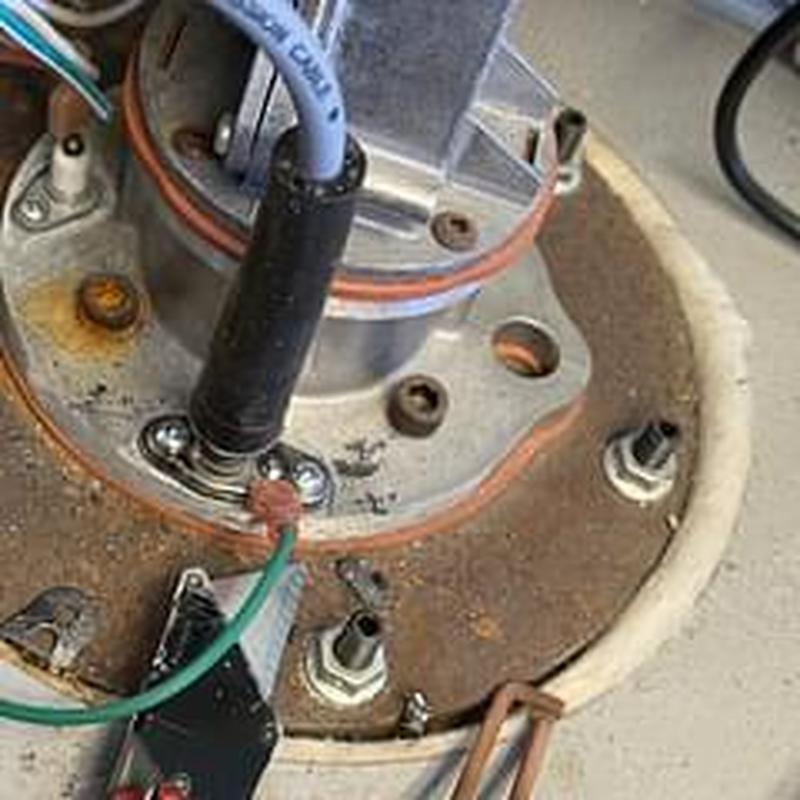 Flame rods and spark igniter on roof water heater